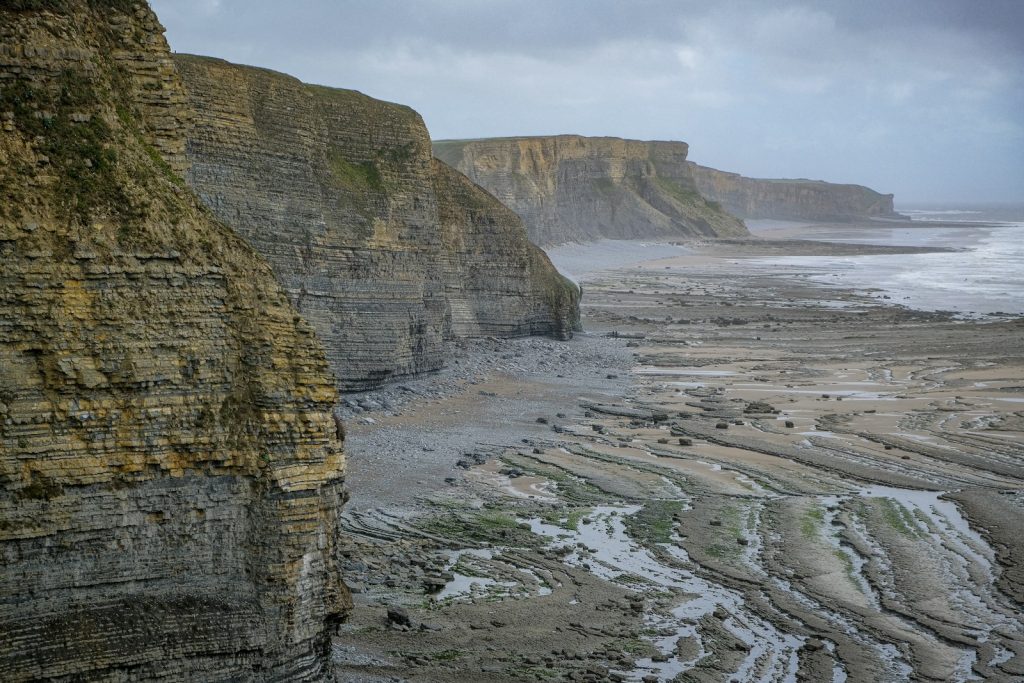 Layered limestone cliffs above a rocky beach on the Glamorgan Heritage Coast